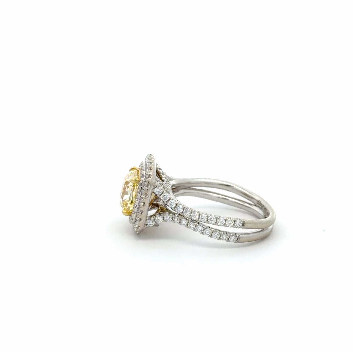 Double Halo Ring in 14kt. White Gold with 2 carat Natural Mined GIA Fancy Light Yellow Cushion with Round Diamonds on the band.
