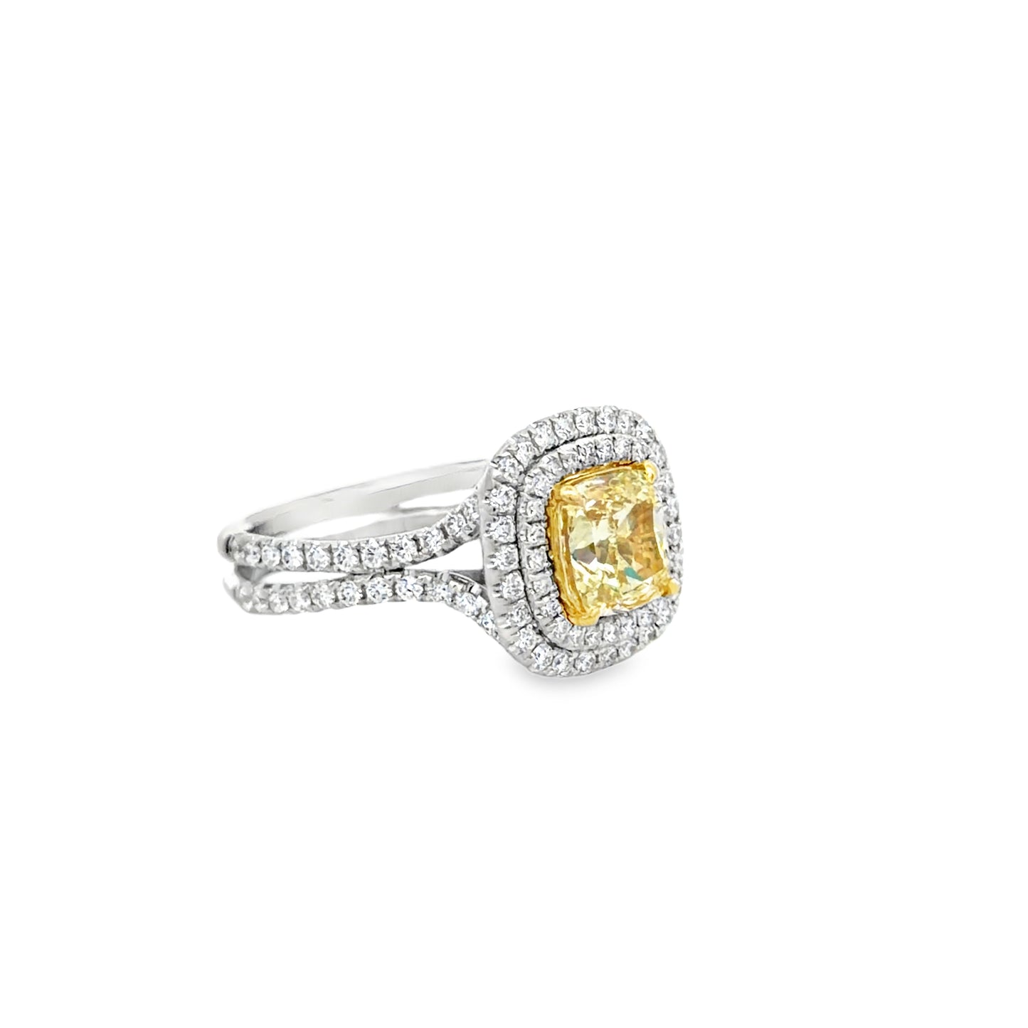 Double Halo Ring in 14kt. White Gold with 2 carat Natural Mined GIA Fancy Light Yellow Cushion with Round Diamonds on the band.