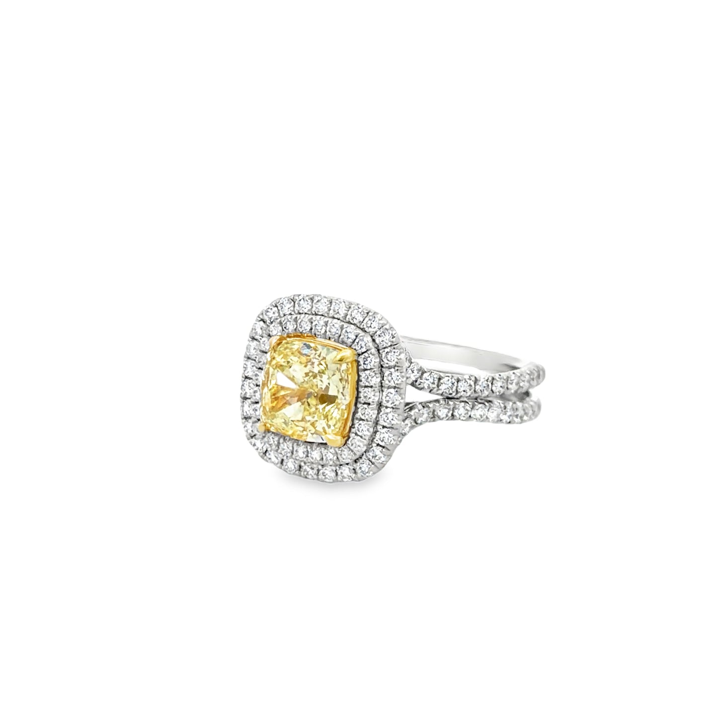 Double Halo Ring in 14kt. White Gold with 2 carat Natural Mined GIA Fancy Light Yellow Cushion with Round Diamonds on the band.