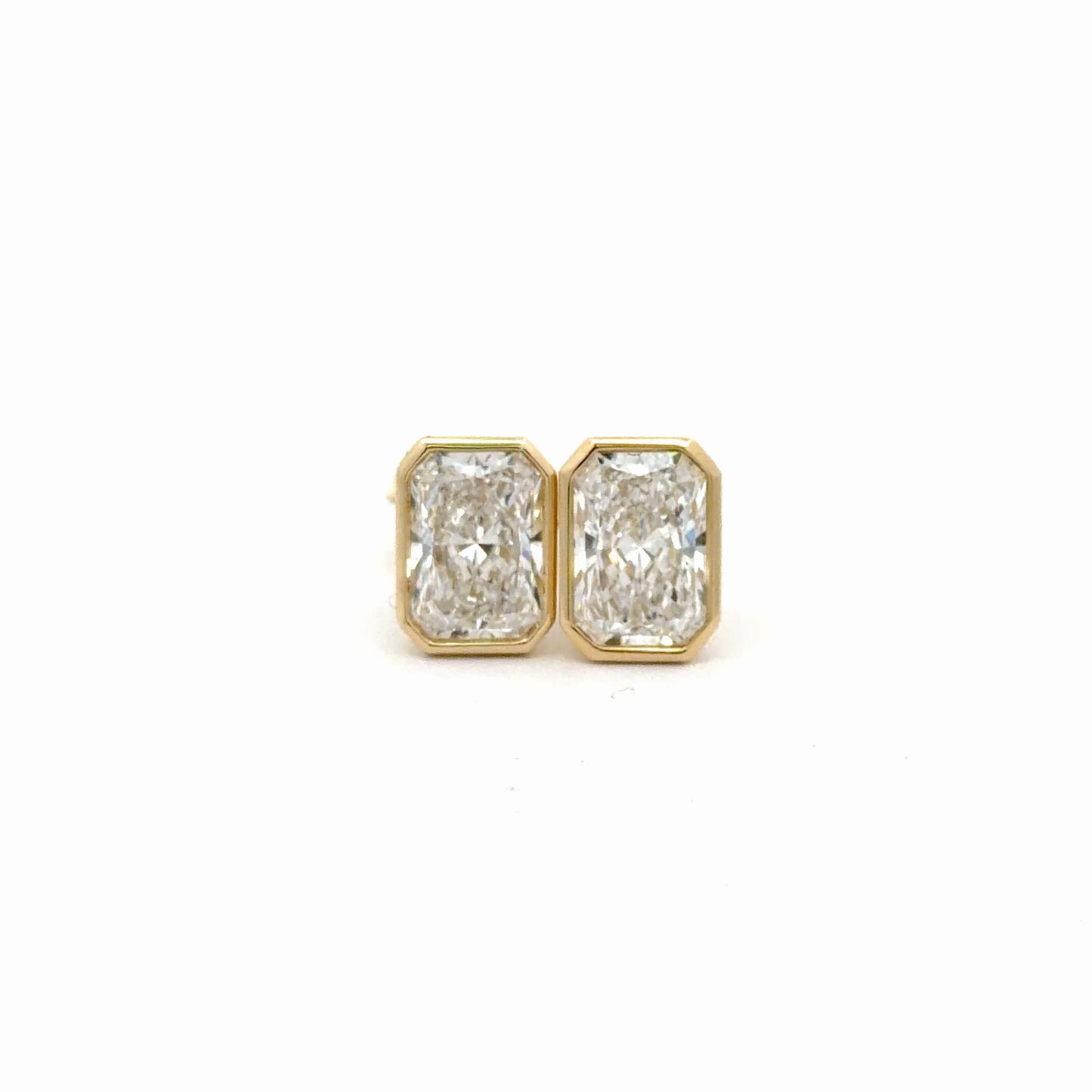 4.13 carat Radiant Cut Lab-Grown Bezel Set Studs in 14 YG.