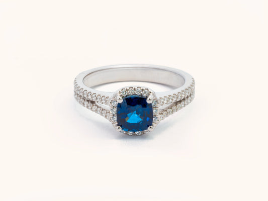 Blue Sapphire and Diamond Halo Engagement Ring in 18K White Gold
