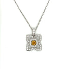 18 Karat White Gold Flower Pendant with a Natural Orange Yellow Radiant Center Diamond and Fine White Round Diamond Accents - FlawlessCarat