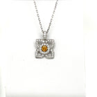 18 Karat White Gold Flower Pendant with a Natural Orange Yellow Radiant Center Diamond and Fine White Round Diamond Accents - FlawlessCarat