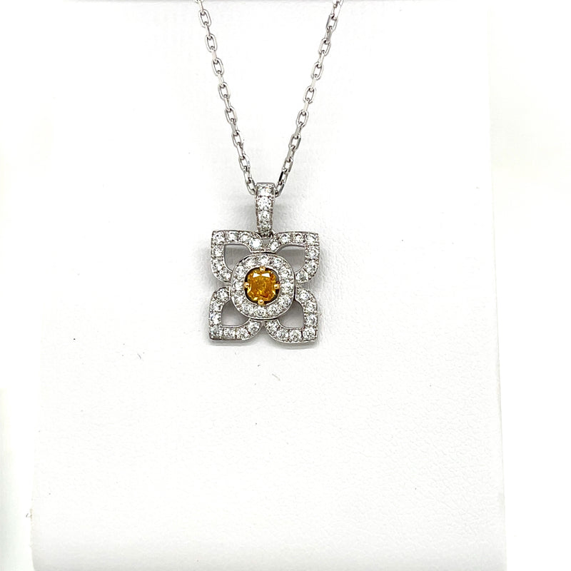 18 Karat White Gold Flower Pendant with a Natural Orange Yellow Radiant Center Diamond and Fine White Round Diamond Accents - FlawlessCarat